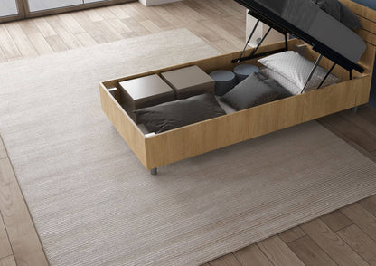 Letto singolo legno chiaro Nuamo 80x200 con contenitore aperto, pratico per riporre oggetti e mantenere ordine.