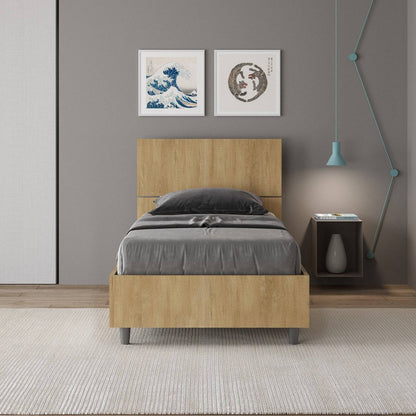 Letto singolo 80x200 Demas effetto legno chiaro in una camera moderna, con testata dritta e giroletto in nobilitato, perfetto per arredamenti eleganti.