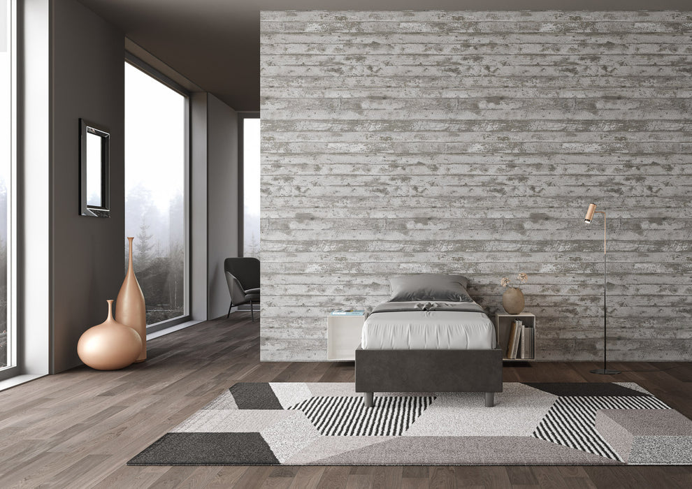 Letto singolo imbottito Azelia antracite 80x190 in microfibra, inserito in ambiente moderno con vista panoramica.