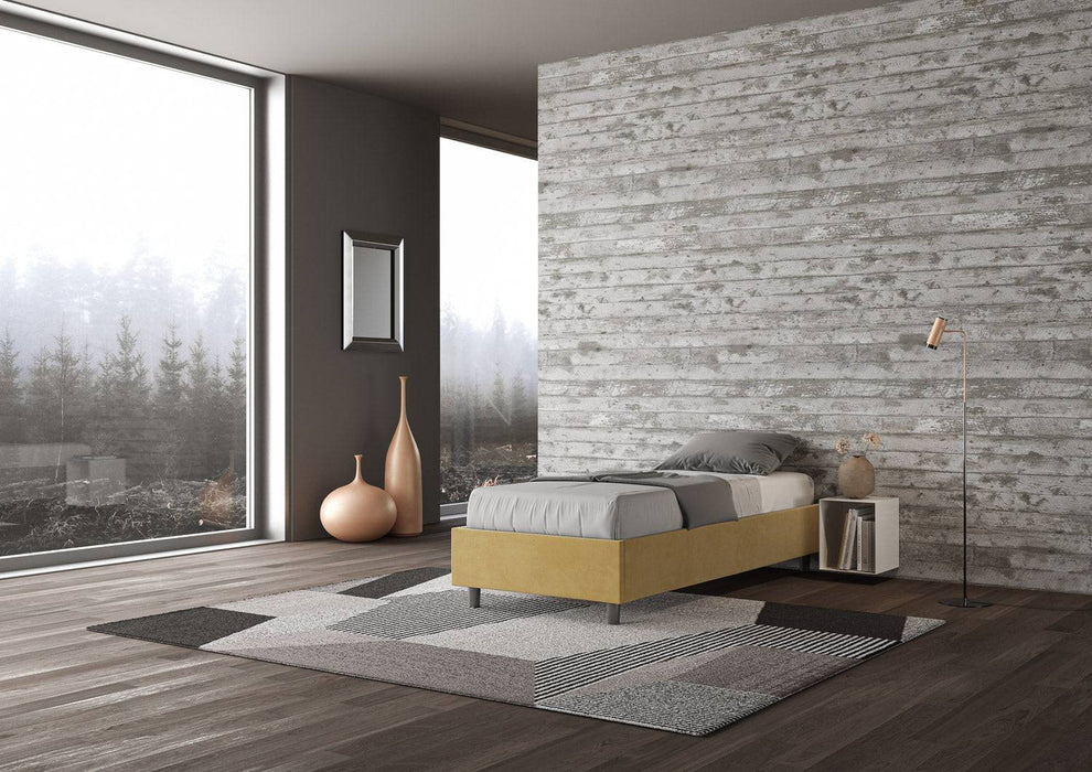 Letto singolo contenitore imbottito 90x200 microfibra Azelia giallo in ambiente moderno, ideale per camere creative e funzionali.