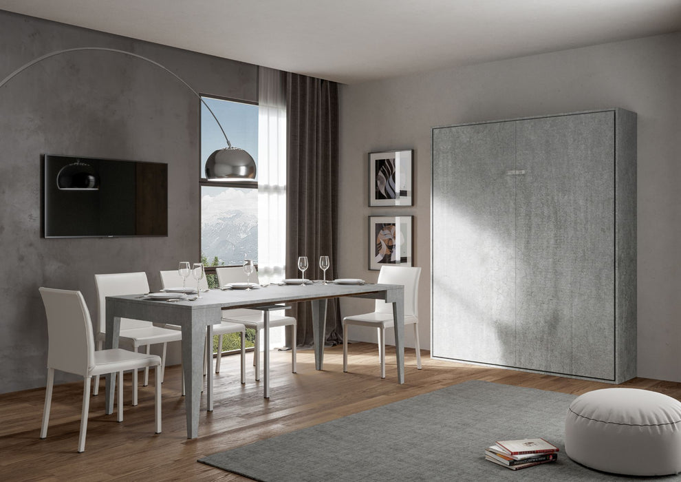 Letto Kentaro chiuso in cemento scuro in soggiorno moderno, perfetto per ambienti multifunzionali.