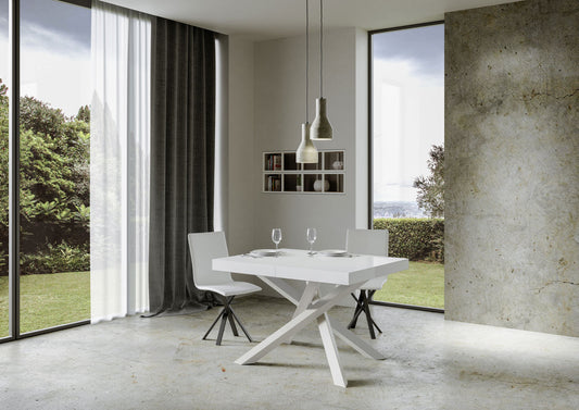 Tavolo Volantis estensibile bianco P.90, design elegante con struttura incrociata, perfetto per spazi contemporanei e versatili.